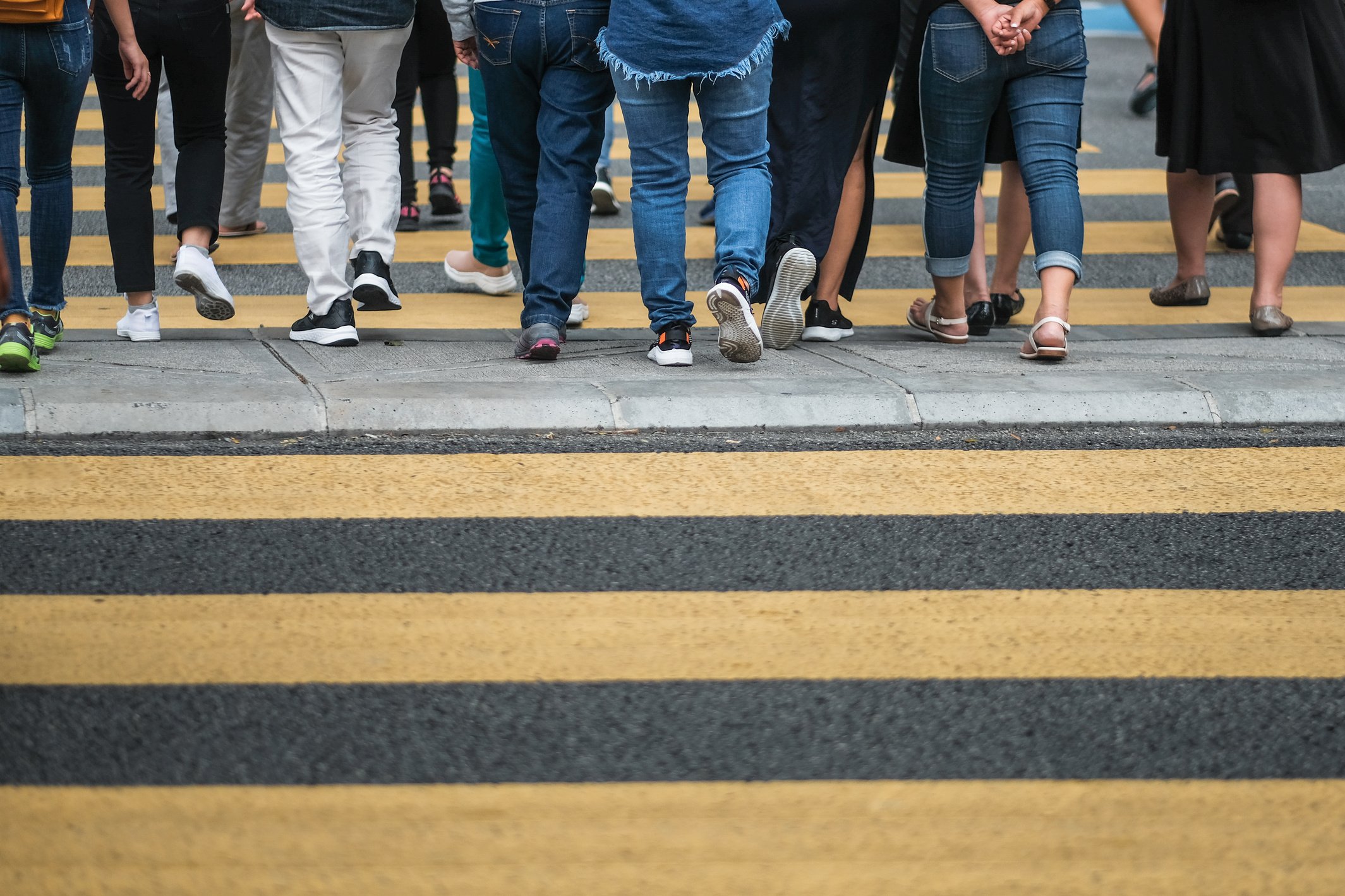 People crossing the pedestrian lanes 